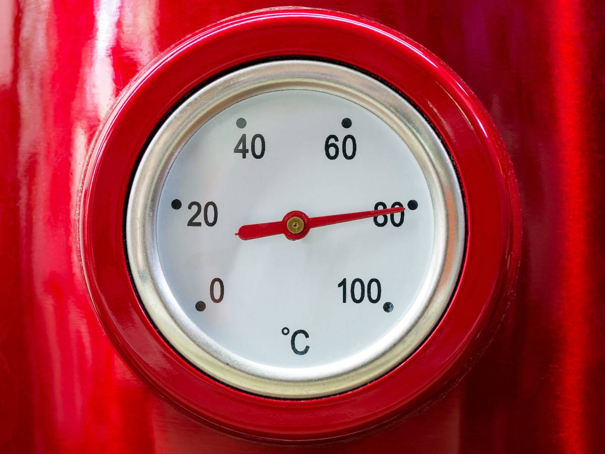 refrigerator temperature monitoring system showing dual-probe readings inside a stainless steel refrigerator, with one probe in crisper drawer and another on middle shelf